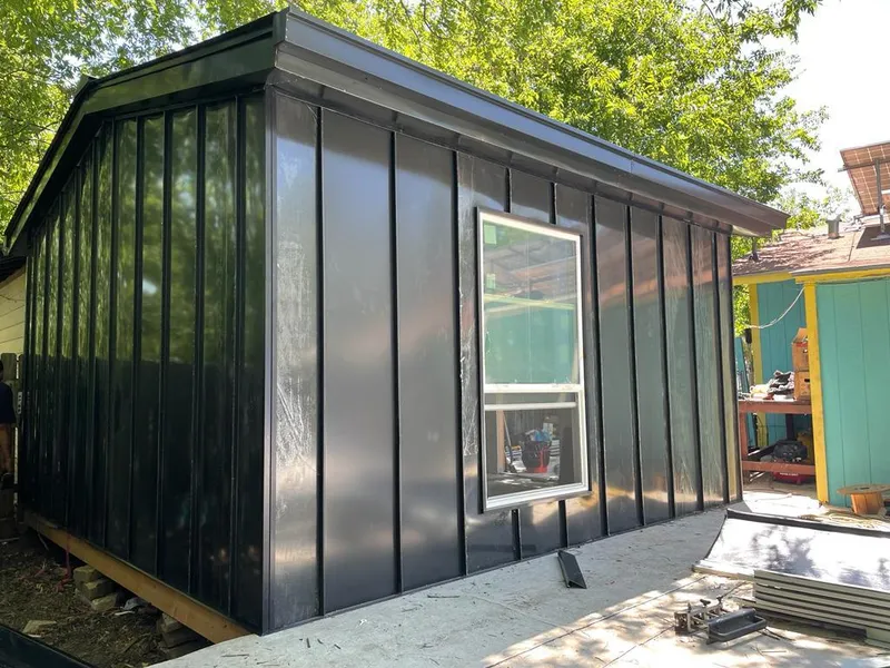 Black standing seam metal wall panels for Roof Inspection in Parker